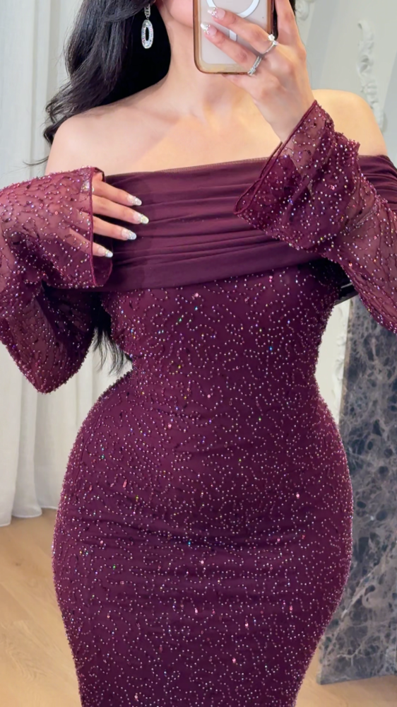 Long burgundy evening dress decorated with tulle folds