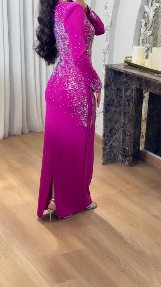 A luxurious fuchsia evening dress studded with crystals