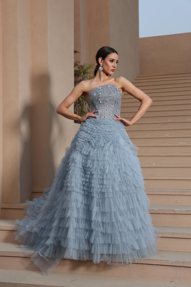 A luxurious evening dress in a calm sky color