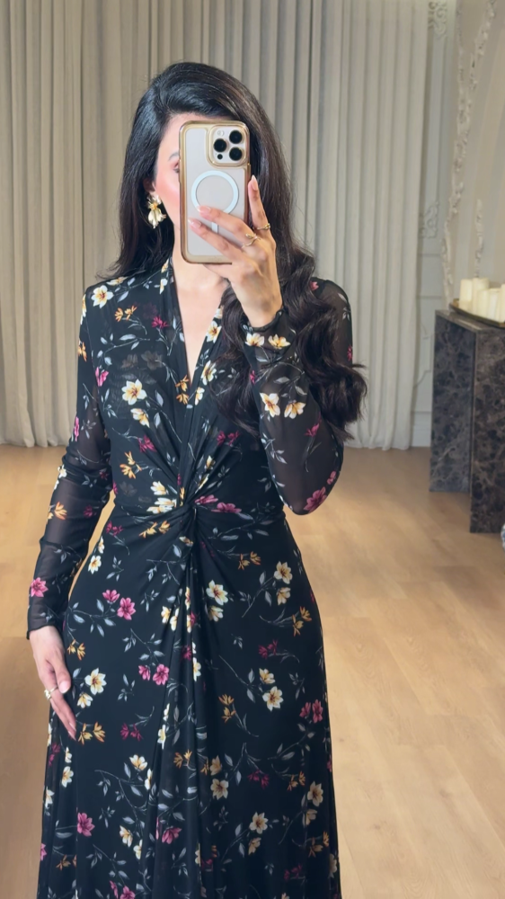 Elegant long black dress decorated with colorful floral patterns