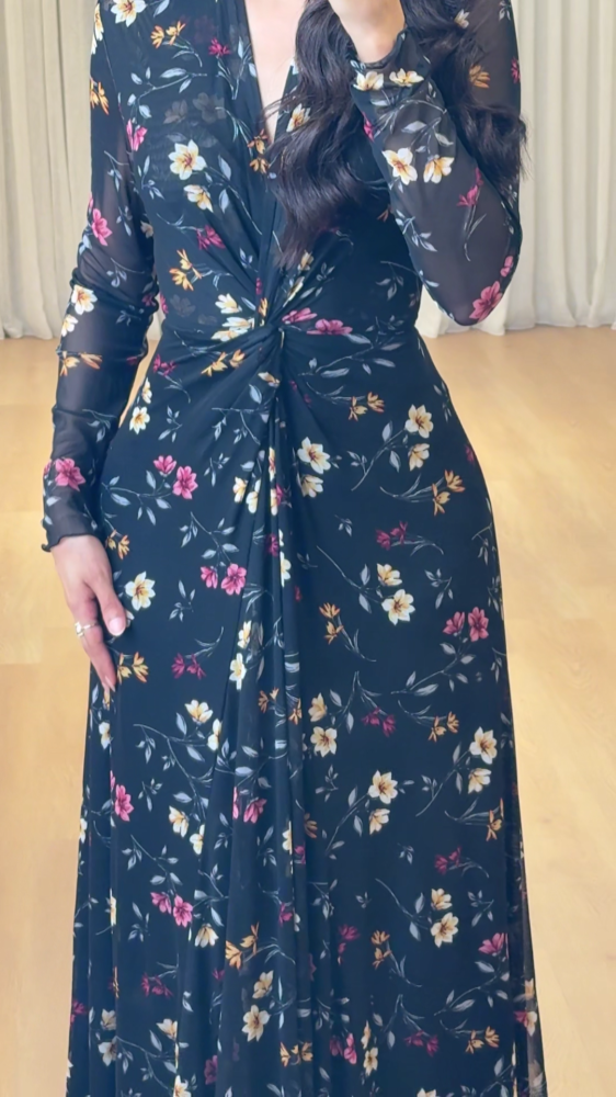 Elegant long black dress decorated with colorful floral patterns