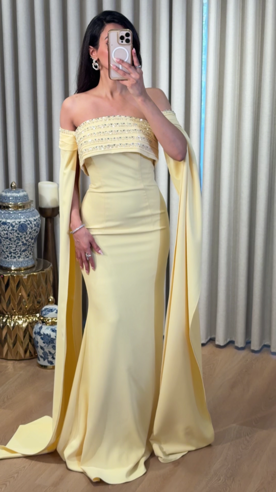 Luxurious evening dress in soft pastel yellow