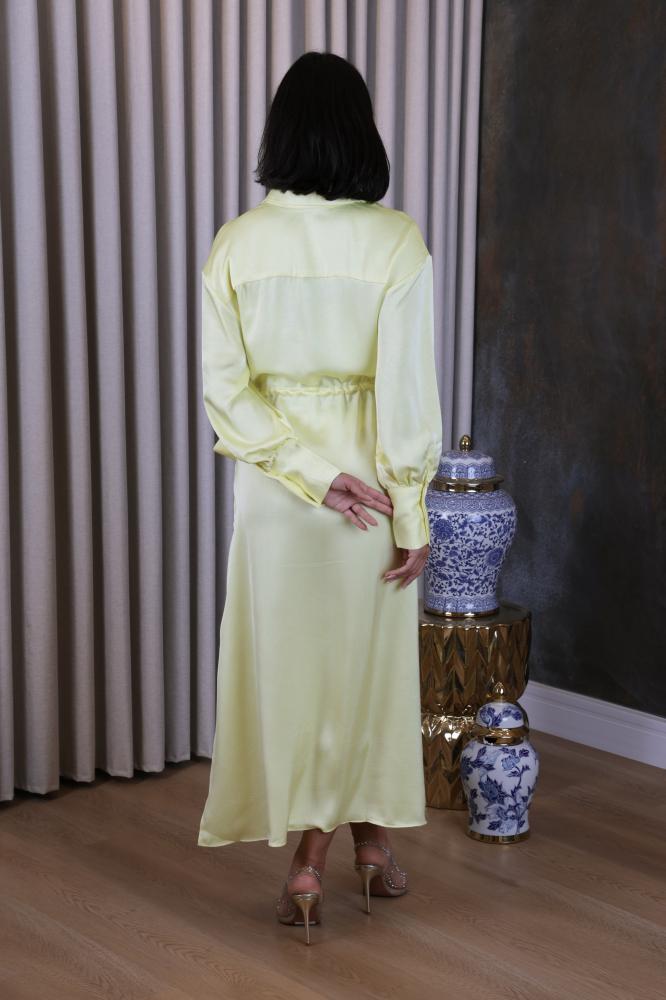Luxurious satin dress in soft pastel yellow