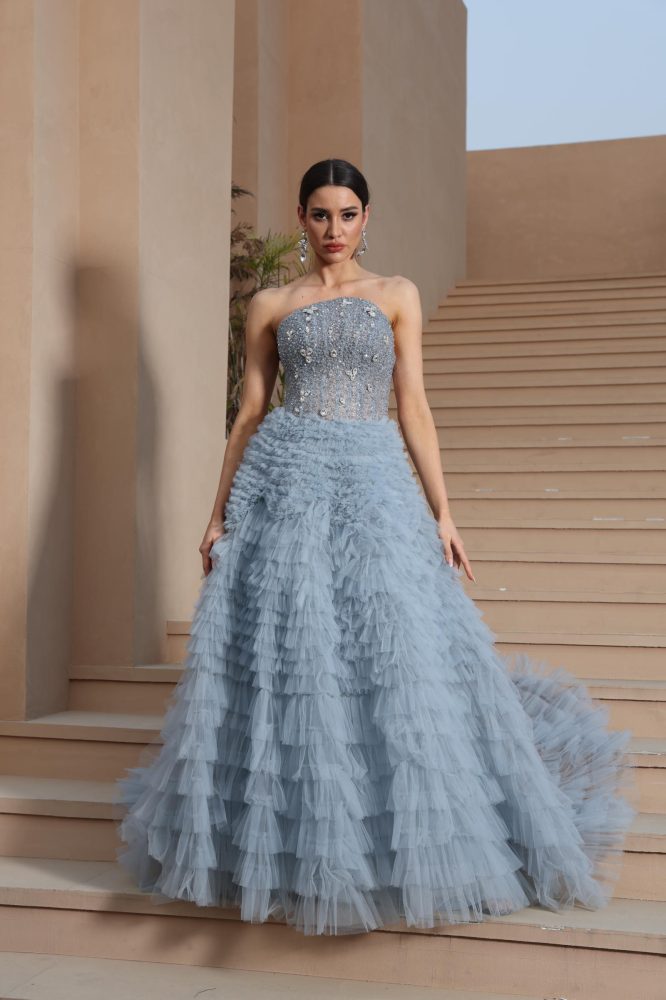 A luxurious evening dress in a calm sky color
