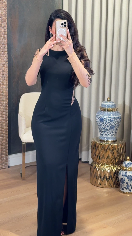 Black dress with transparent details and luxurious embroidery