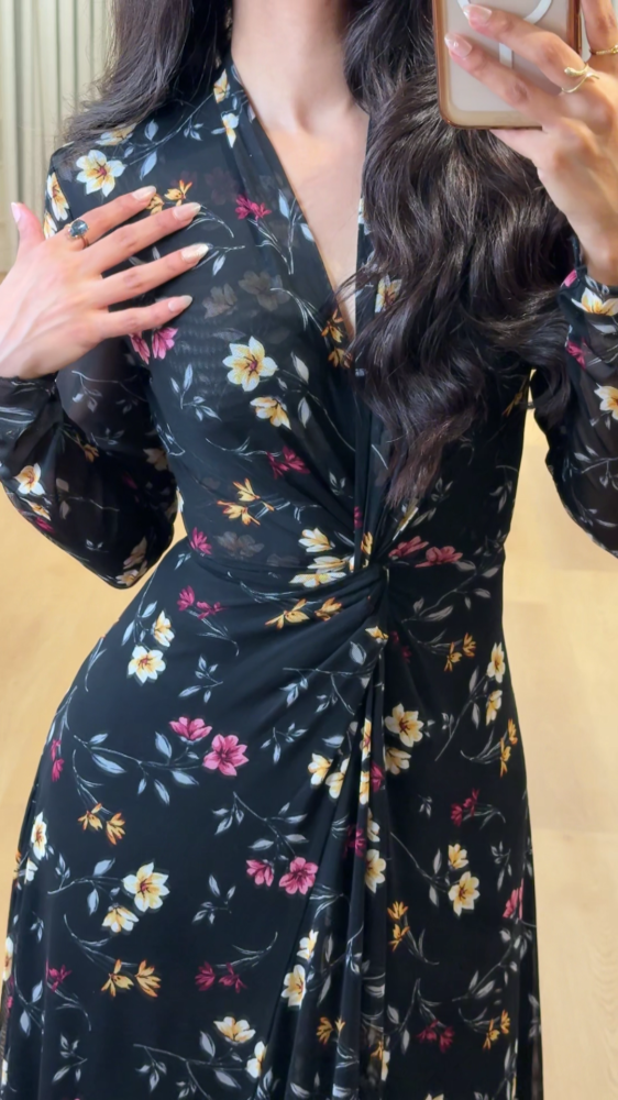 Elegant long black dress decorated with colorful floral patterns