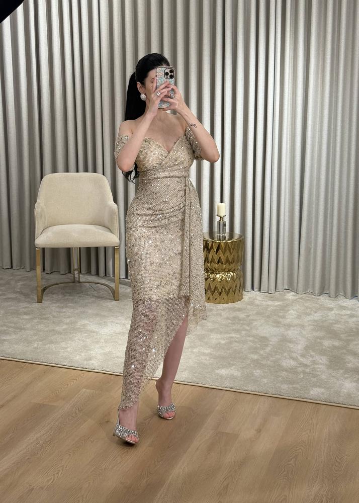 Golden evening dress in mesh fabric completely studded with crystals