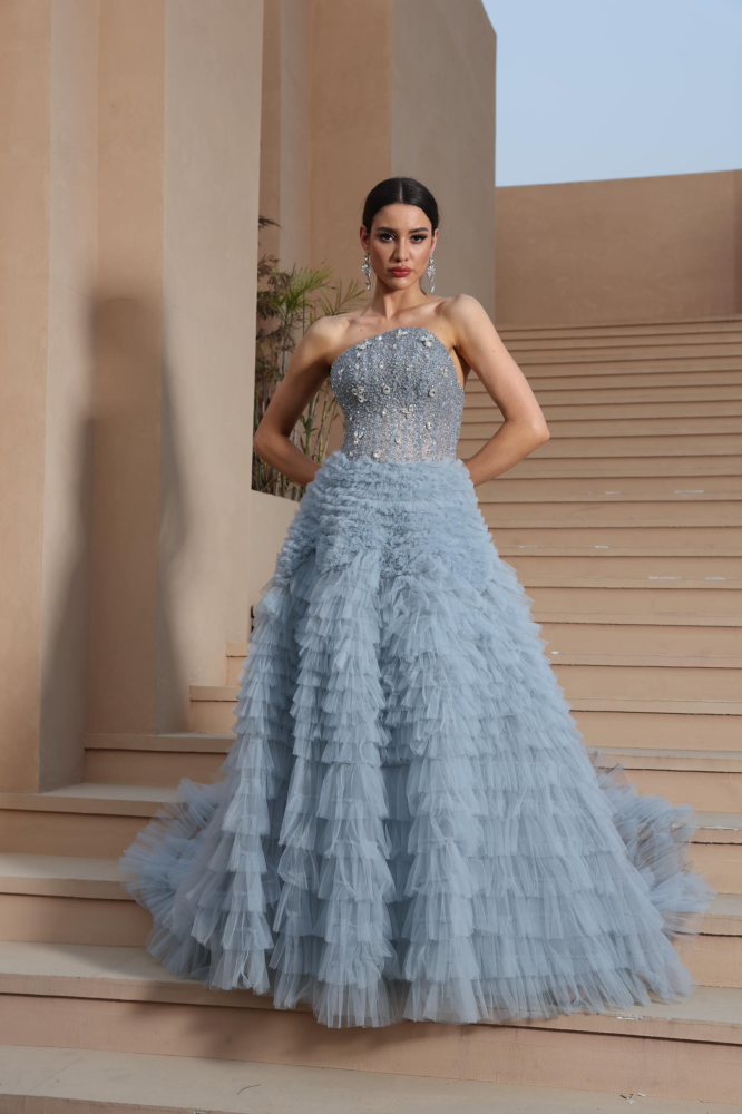 A luxurious evening dress in a calm sky color