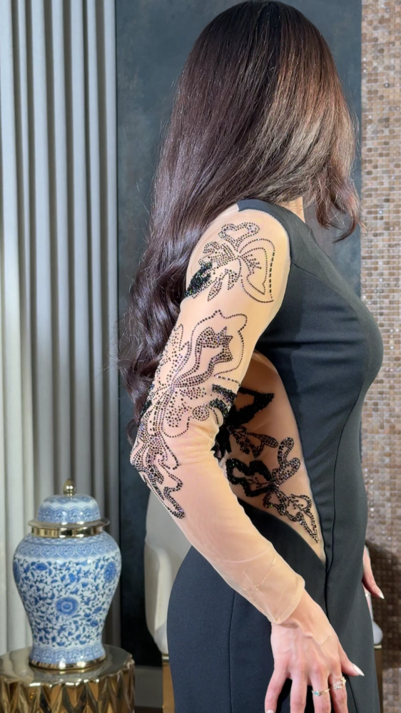 Black dress with transparent details and luxurious embroidery