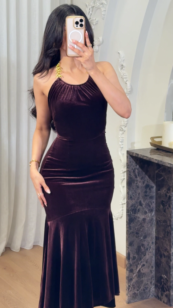 Luxurious mocha velvet dress decorated with gold accessories