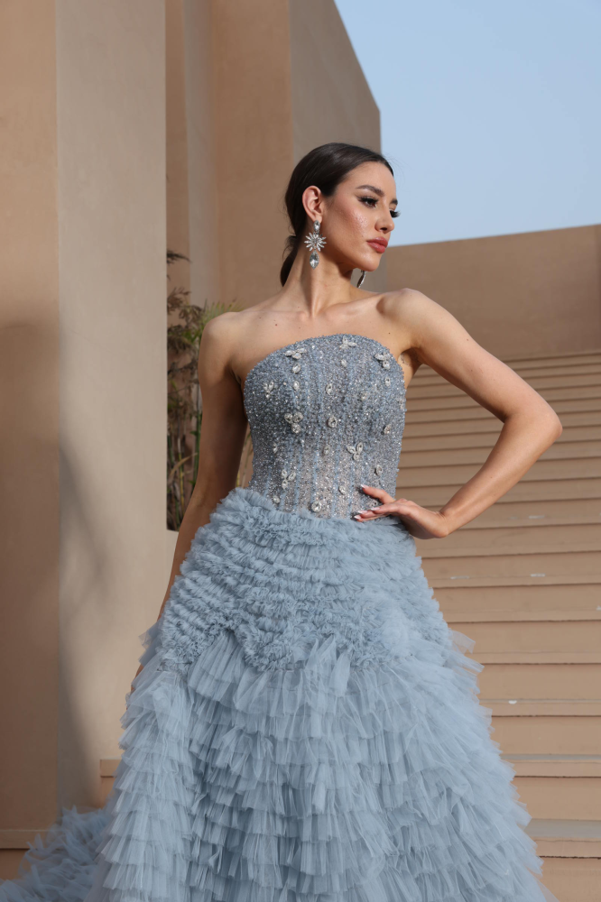 A luxurious evening dress in a calm sky color