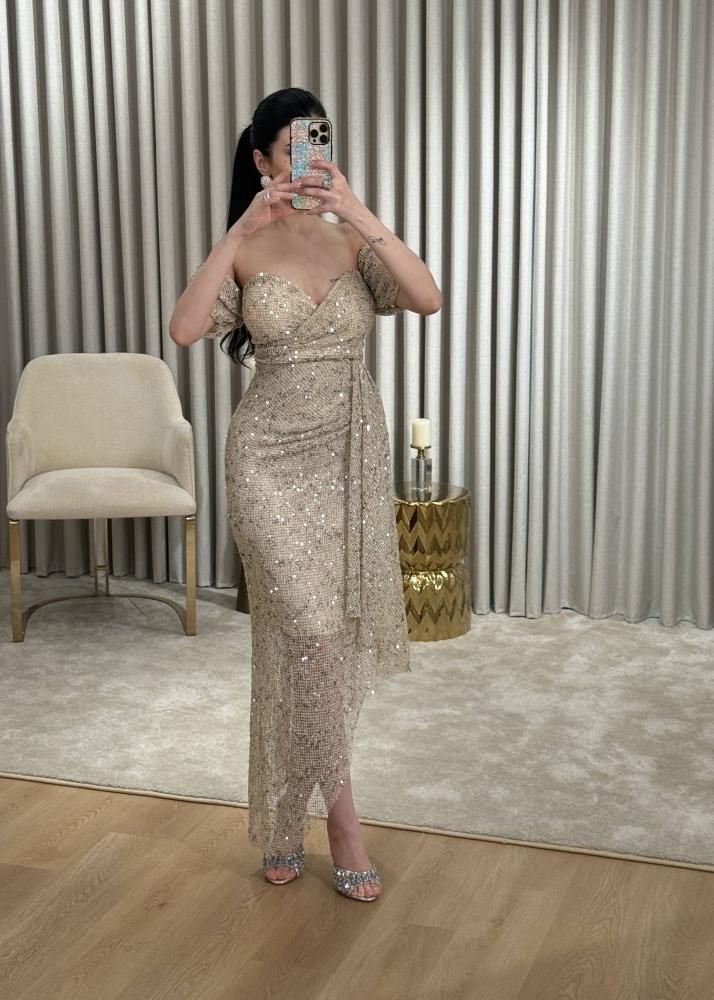Golden evening dress in mesh fabric completely studded with crystals