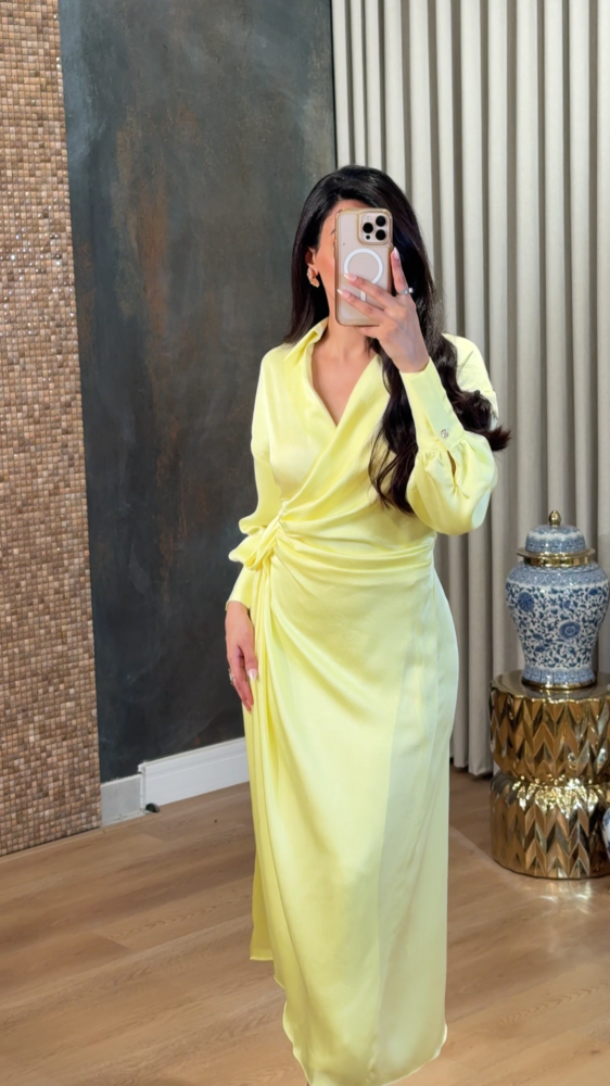 Luxurious satin dress in soft pastel yellow