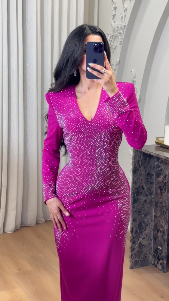 A luxurious fuchsia evening dress studded with crystals