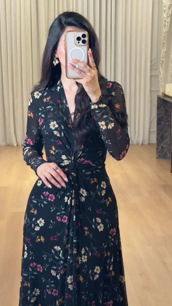 Elegant long black dress decorated with colorful floral patterns