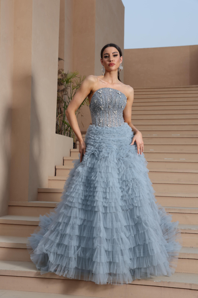 A luxurious evening dress in a calm sky color