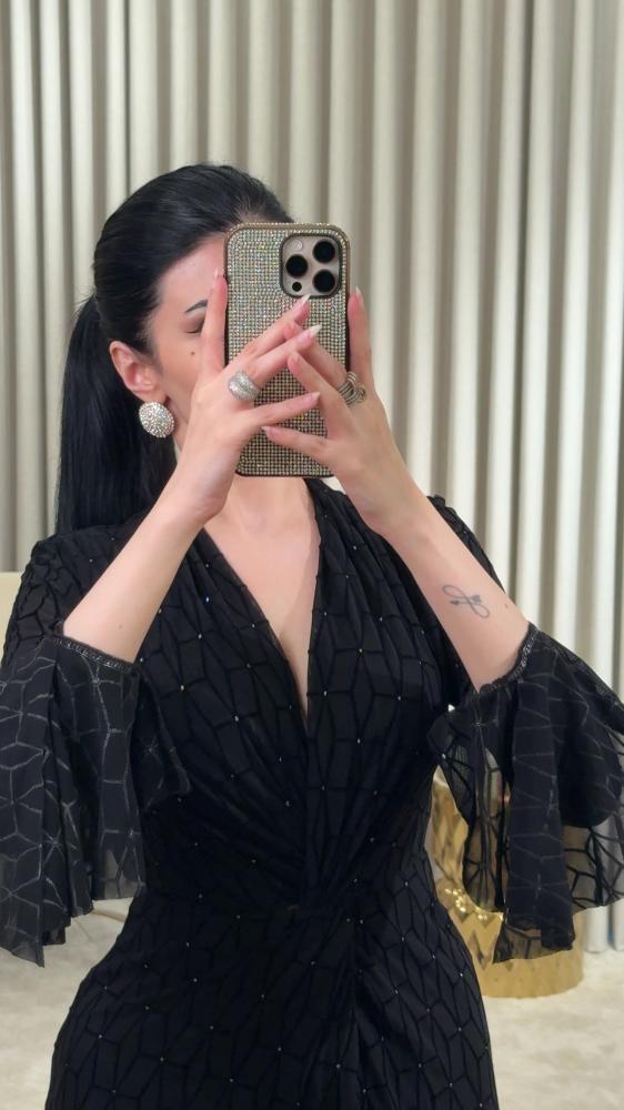 Black dress with luxurious geometric patterns