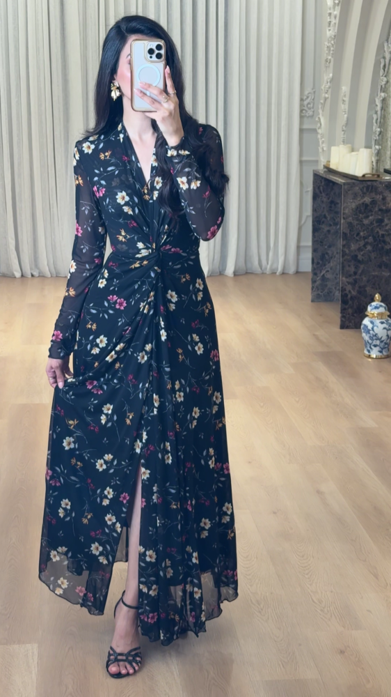 Elegant long black dress decorated with colorful floral patterns