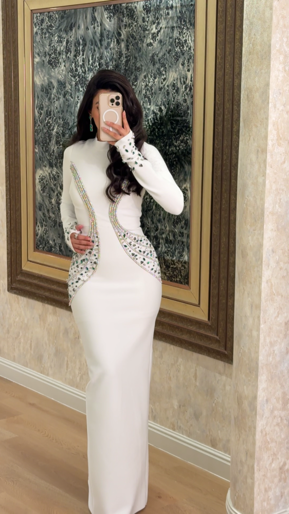 Royal white evening dress studded with crystals