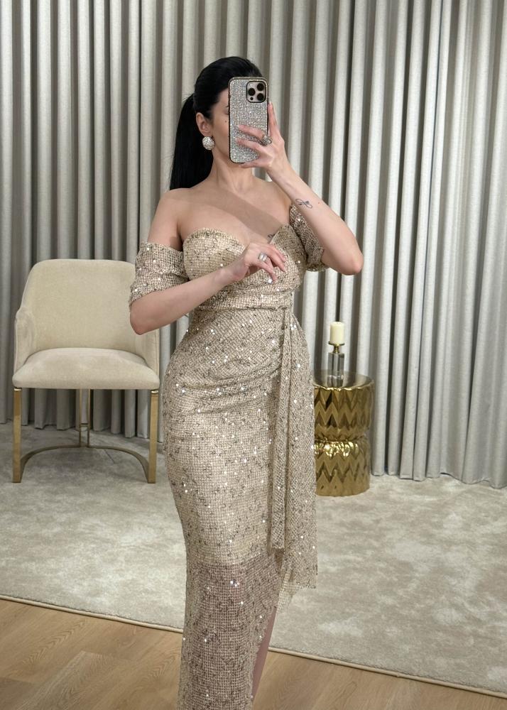 Golden evening dress in mesh fabric completely studded with crystals