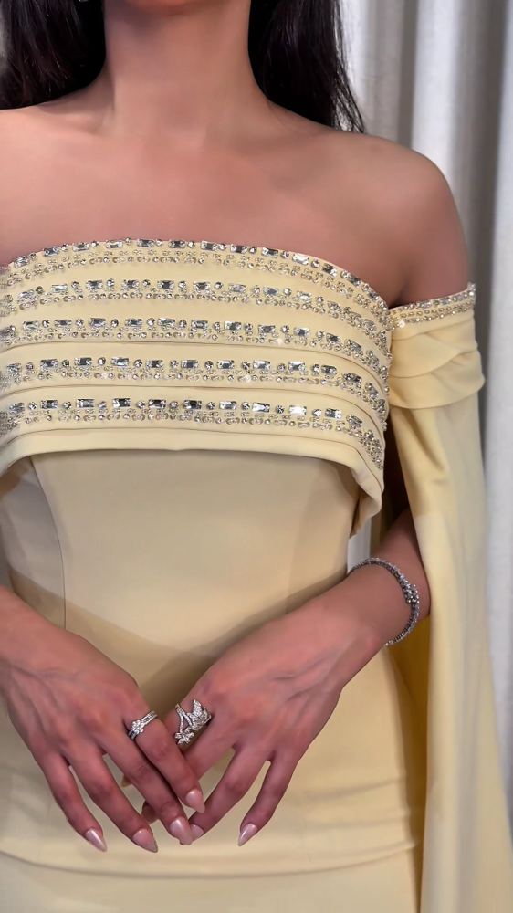 Luxurious evening dress in soft pastel yellow