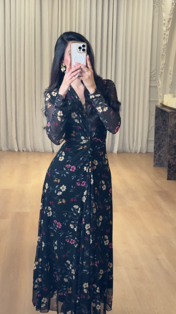 Elegant long black dress decorated with colorful floral patterns