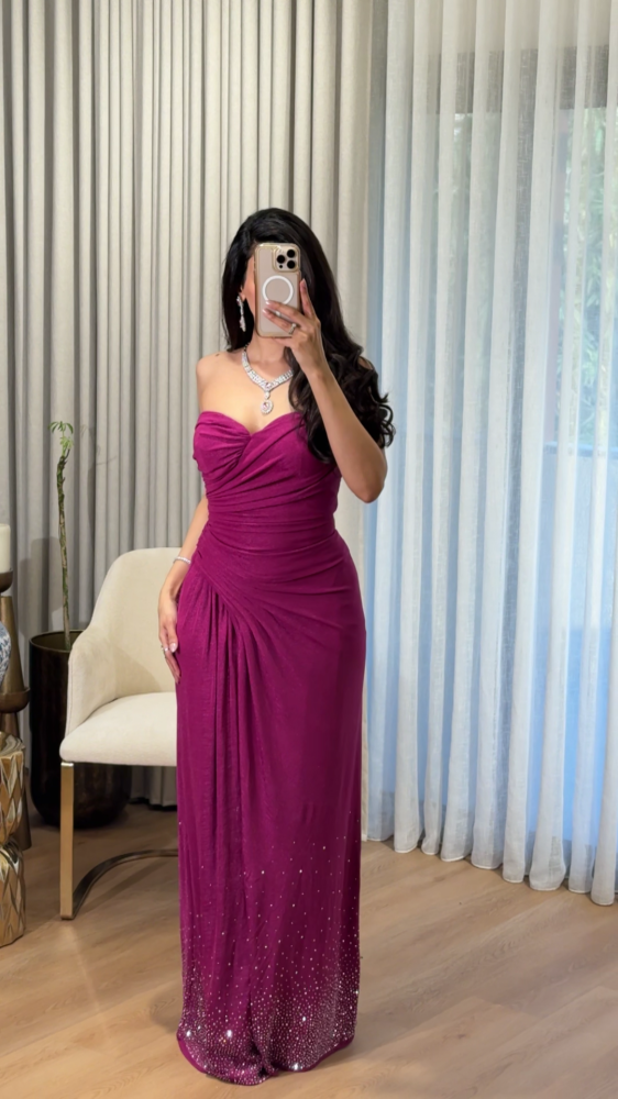 Pink top evening dress decorated with pleats