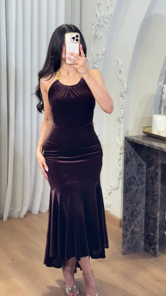 Luxurious mocha velvet dress decorated with gold accessories