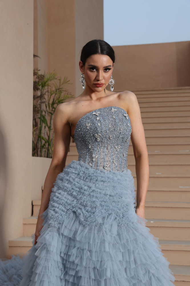 A luxurious evening dress in a calm sky color