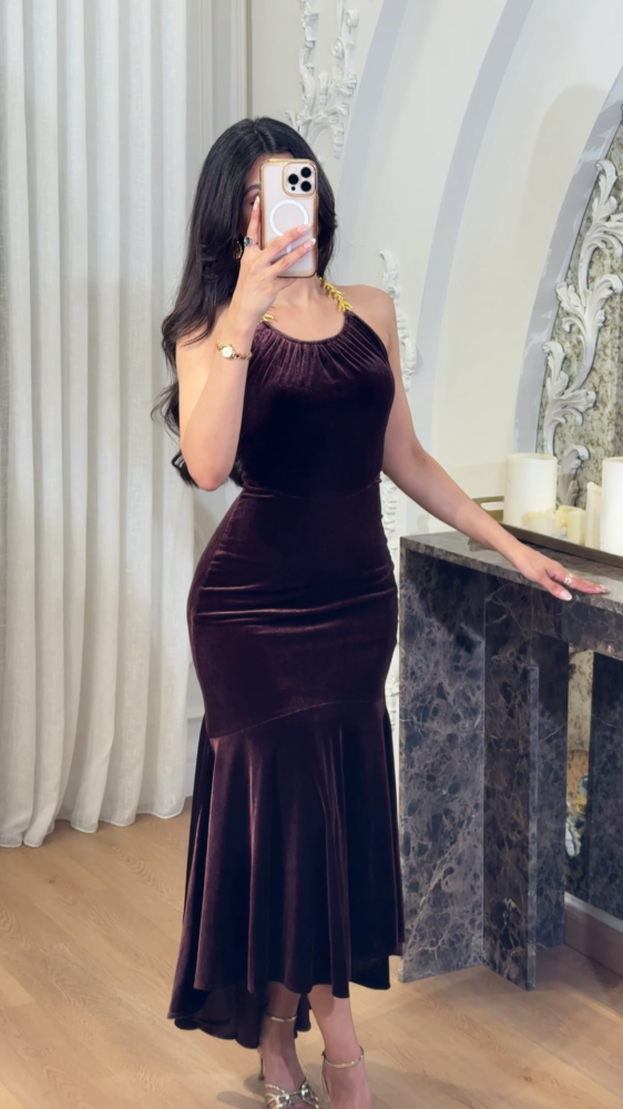 Luxurious mocha velvet dress decorated with gold accessories