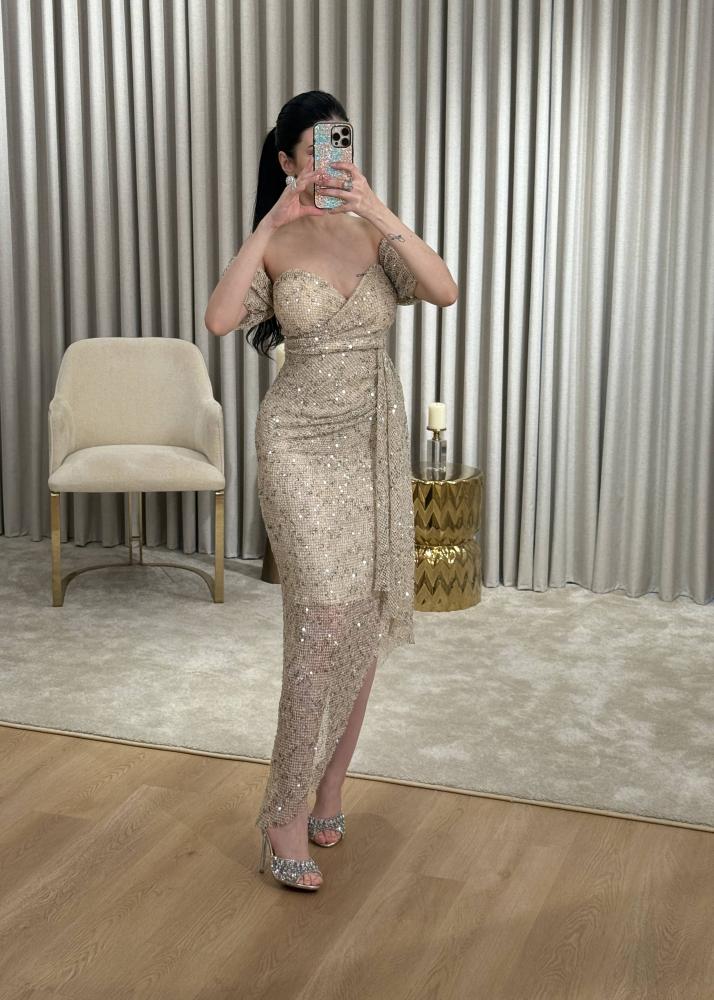 Golden evening dress in mesh fabric completely studded with crystals