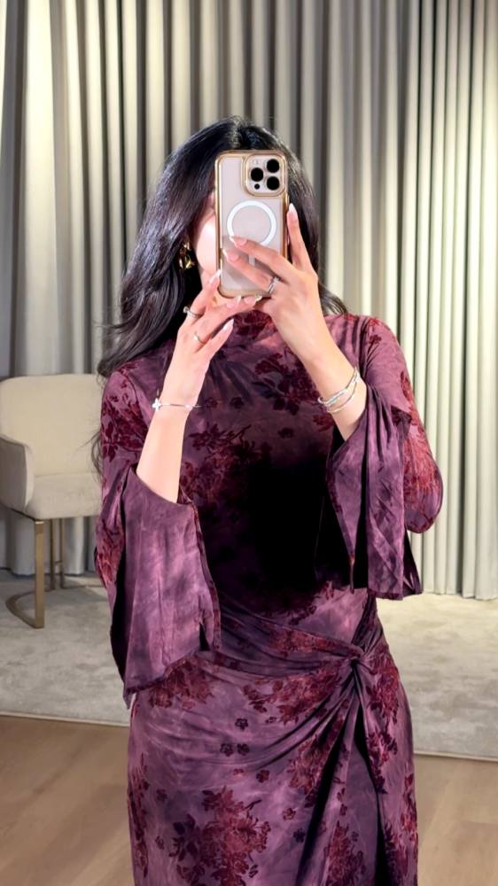 Dark purple dress with a luxurious floral pattern
