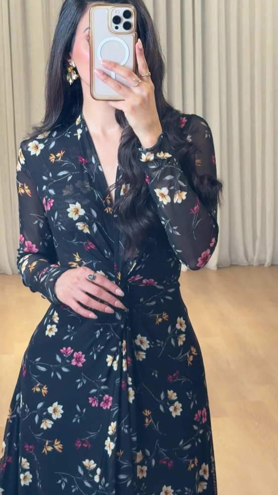 Elegant long black dress decorated with colorful floral patterns