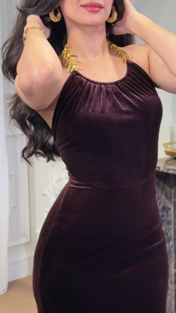 Luxurious mocha velvet dress decorated with gold accessories