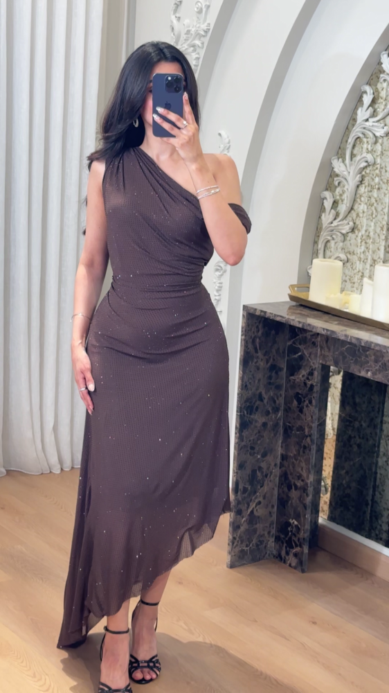 A luxurious mocha evening dress with a sophisticated feminine design