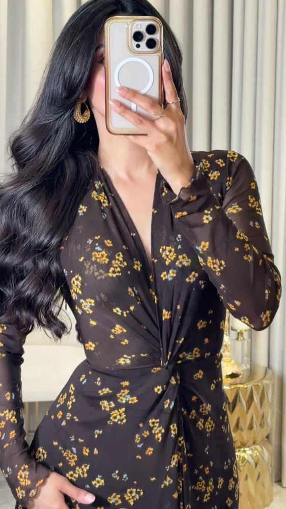 Long dark brown dress decorated with small yellow roses