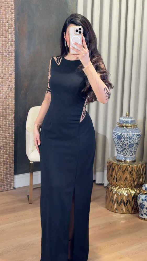 Black dress with transparent details and luxurious embroidery