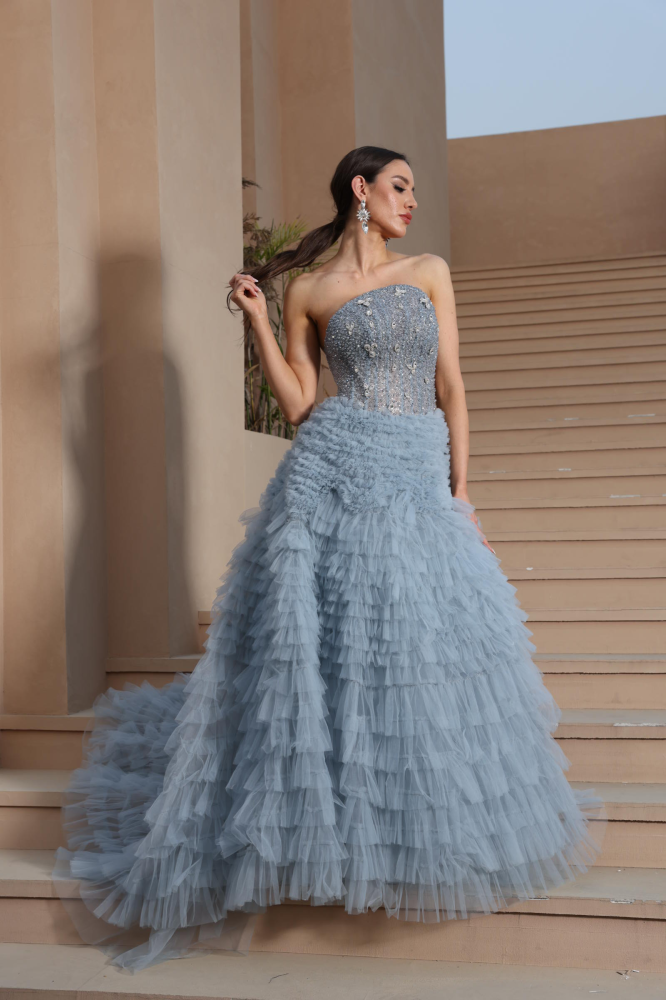 A luxurious evening dress in a calm sky color