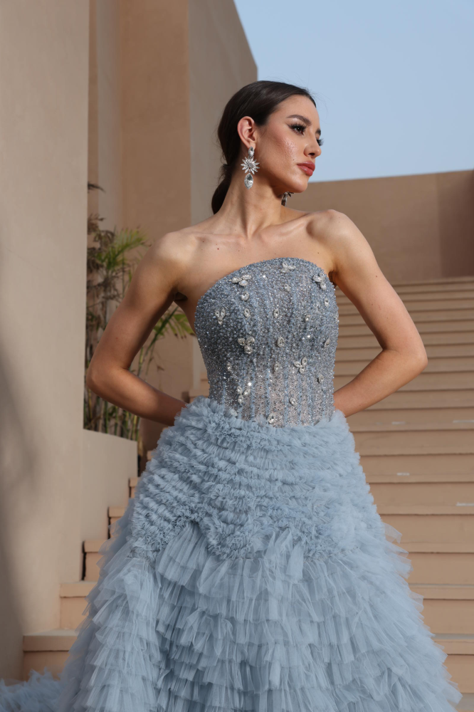 A luxurious evening dress in a calm sky color